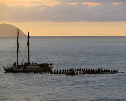 Circle of Invitees Next to Hokulea at the Eddie Aikau Big Wave Invitational Opening Ceremony, Waimea Bay, Oahu