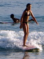 Girl Surfing in Hawaii at Waikiki Beach