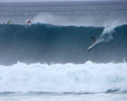 Surfing in Hawaii: Dropping in on a Big Wave at Waimea Bay