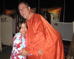 My Daughter Reluctantly Hugs the Fat Clown at Bishop Museum Healthy Kids Day